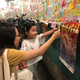 Cassie Chan with her daughter, who wrote words of encouragement for Hong Kong on a Post-it.